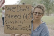 汶上特斯拉在得州奥斯汀遭遇抗议活动：反对马斯克Robotaxi计划